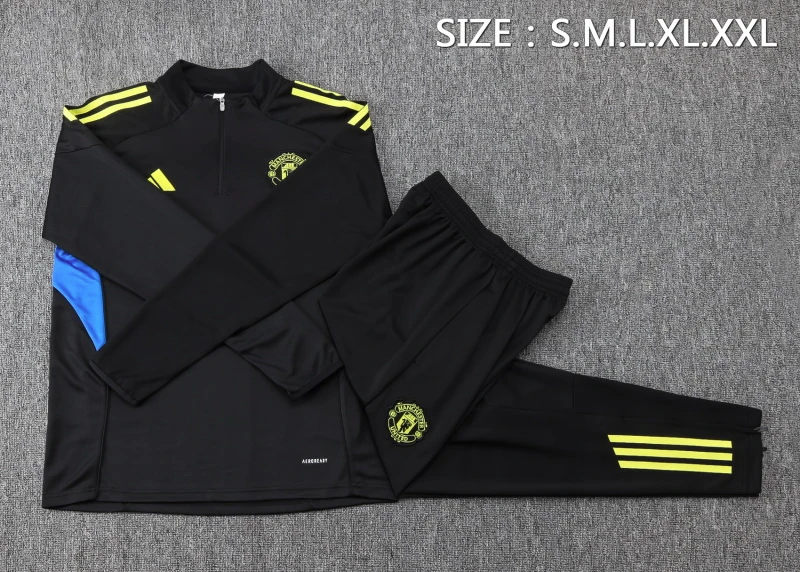 Conjunto Completo Sudadera Entrenamiento Manchester United 2025 2026 Negro Amarillo Manchester United Conjunto 2025 2026 Negro - Maglia Manchester United | tiendasdefutboles