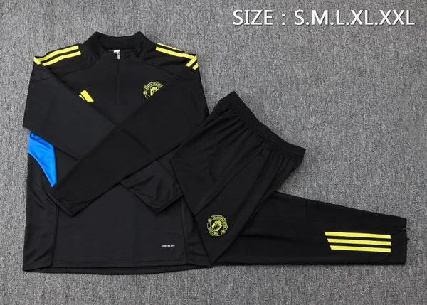 Conjunto Completo Sudadera Entrenamiento Niños Manchester United 2025 2026 Negro Amarillo Manchester United Niños Conjunto 2025 2026 Negro - Equipacion Manchester United Niños | tiendasdefutboles